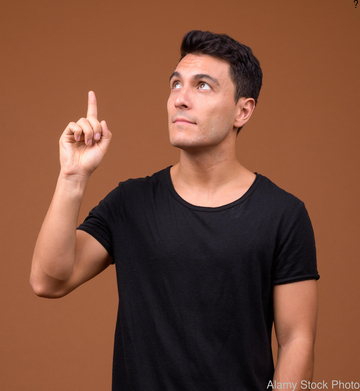 Hypothetical group of modern art collectors viewing works by the artist. (stock photo)