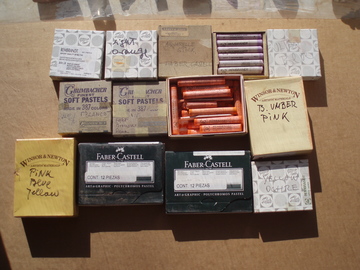 Photo of 13 boxes of pastel sticks made by Winsor & Newton, Faber-Castell, and Grumbacher